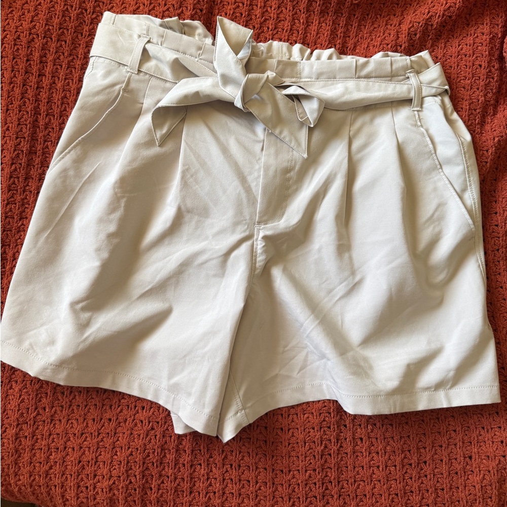 Beige High Waisted Paper Bag shorts with belt and pockets